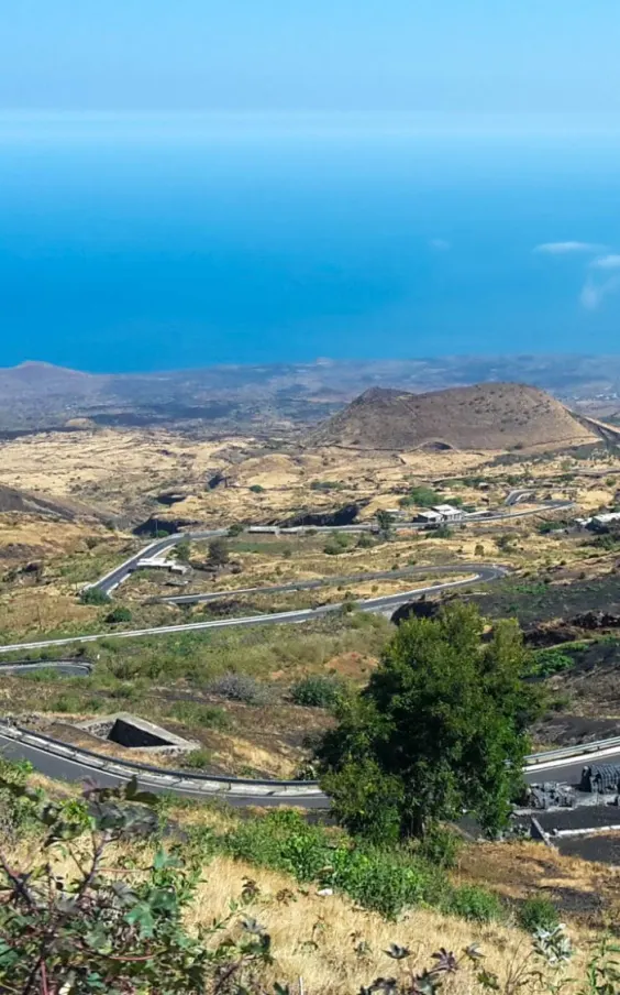 Winding road down the volcano to the sea