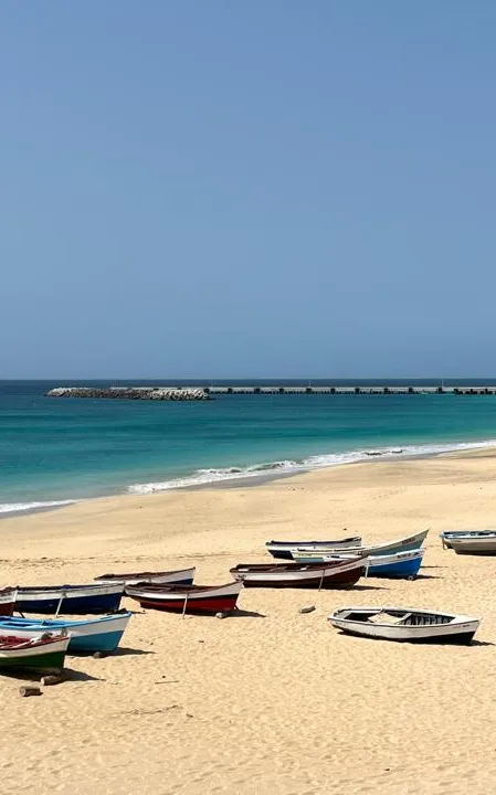 Fishing boats on a golden sand beach
