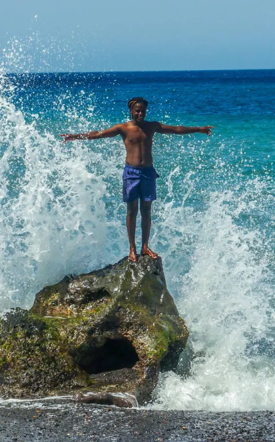 Waves crashing on a rock at the beach